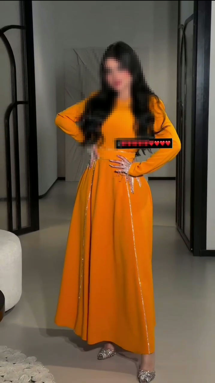 فستان سهرة مبهج باللون البرتقالي أجمل فساتين السعودية